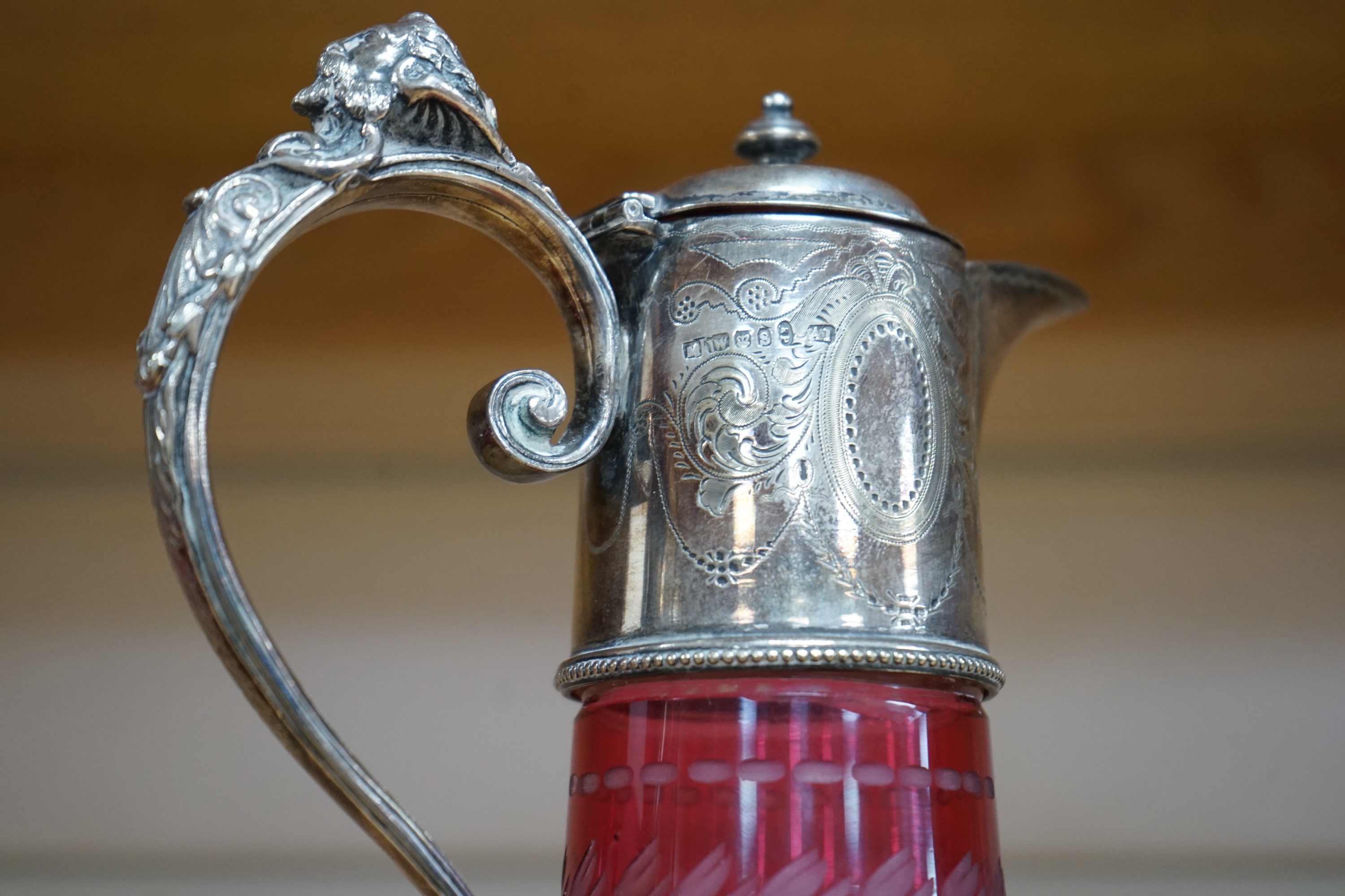 A Victorian electroplate mounted cranberry glass claret jug and a similar goblet by Elkington & Co. 26cm. Condition - good